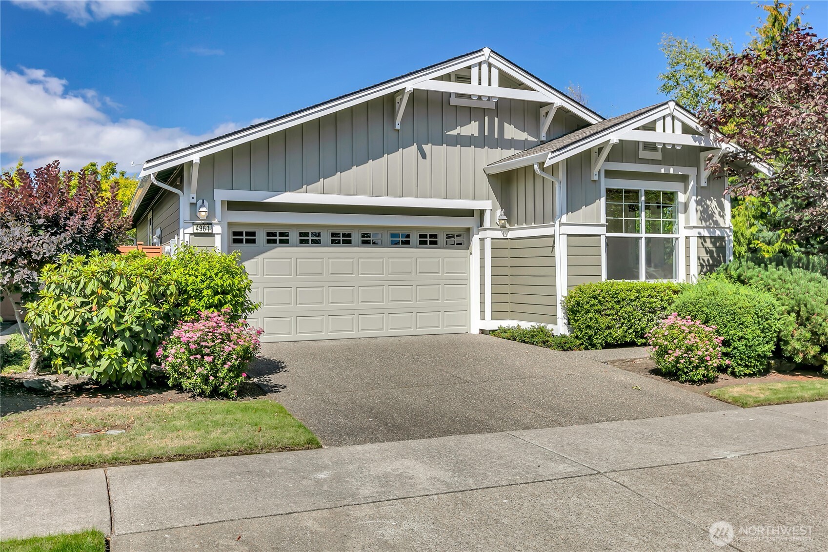 4961 Spokane Street Northeast Lacey, WA 98516 - Photo 2 of 38 a front view of a house with a yard