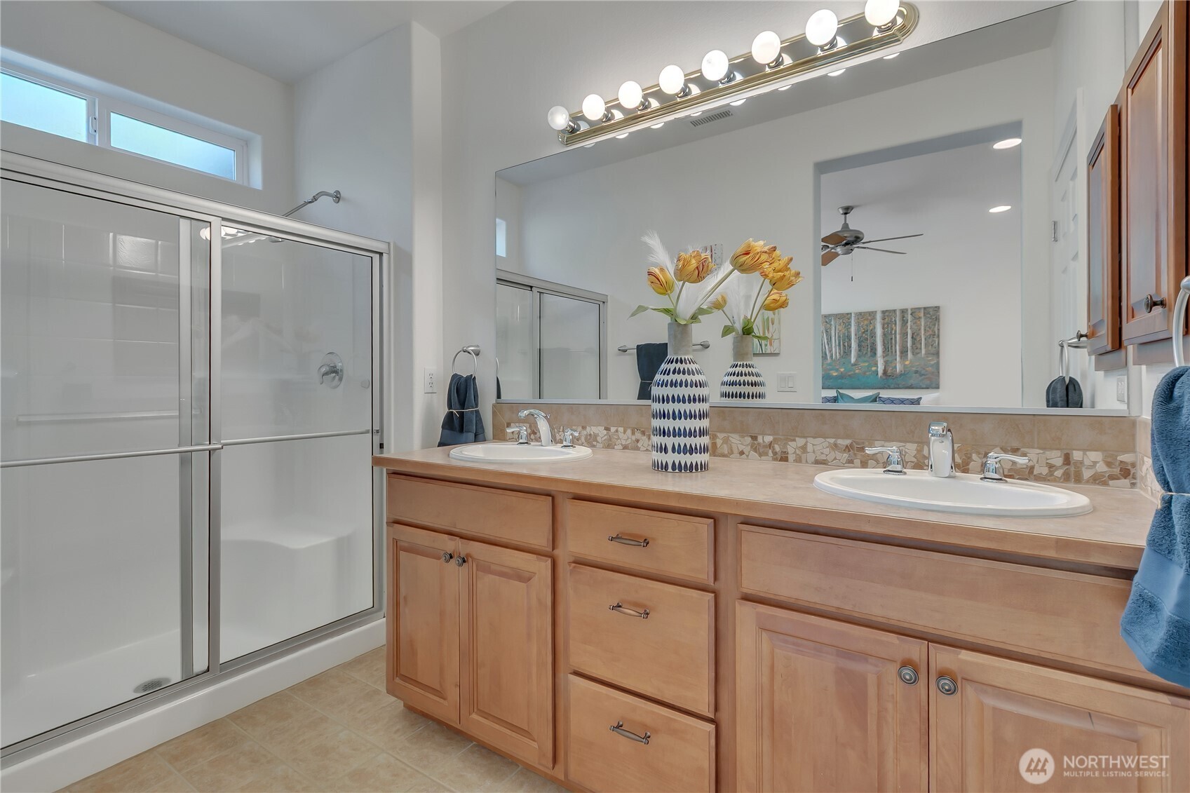 4961 Spokane Street Northeast Lacey, WA 98516 - Photo 22 of 38 a bathroom with a sink vanity and a mirror