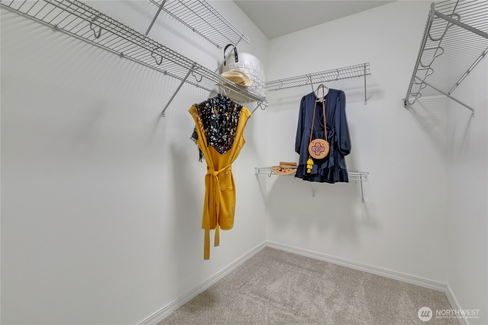 4961 Spokane Street Northeast Lacey, WA 98516 - Photo 23 of 38 a view of walk in closet with clothes and shoes