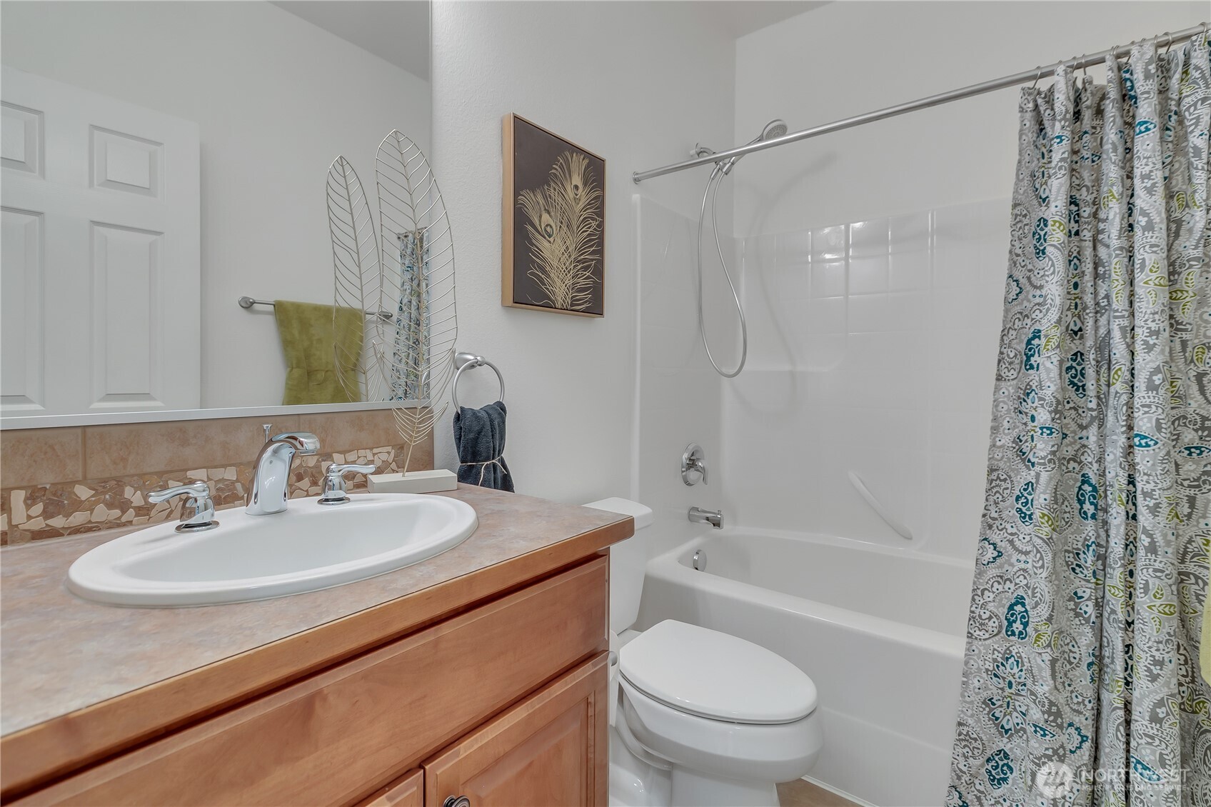 4961 Spokane Street Northeast Lacey, WA 98516 - Photo 25 of 38 a bathroom with a sink toilet and shower