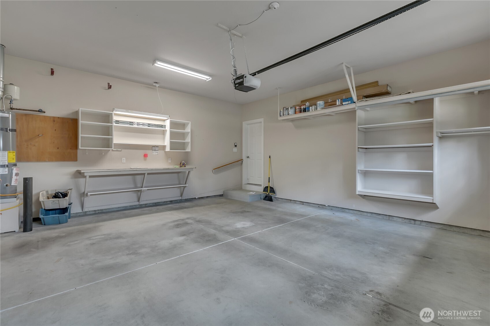 4961 Spokane Street Northeast Lacey, WA 98516 - Photo 26 of 38 a view of an empty room with a cabinet and a window
