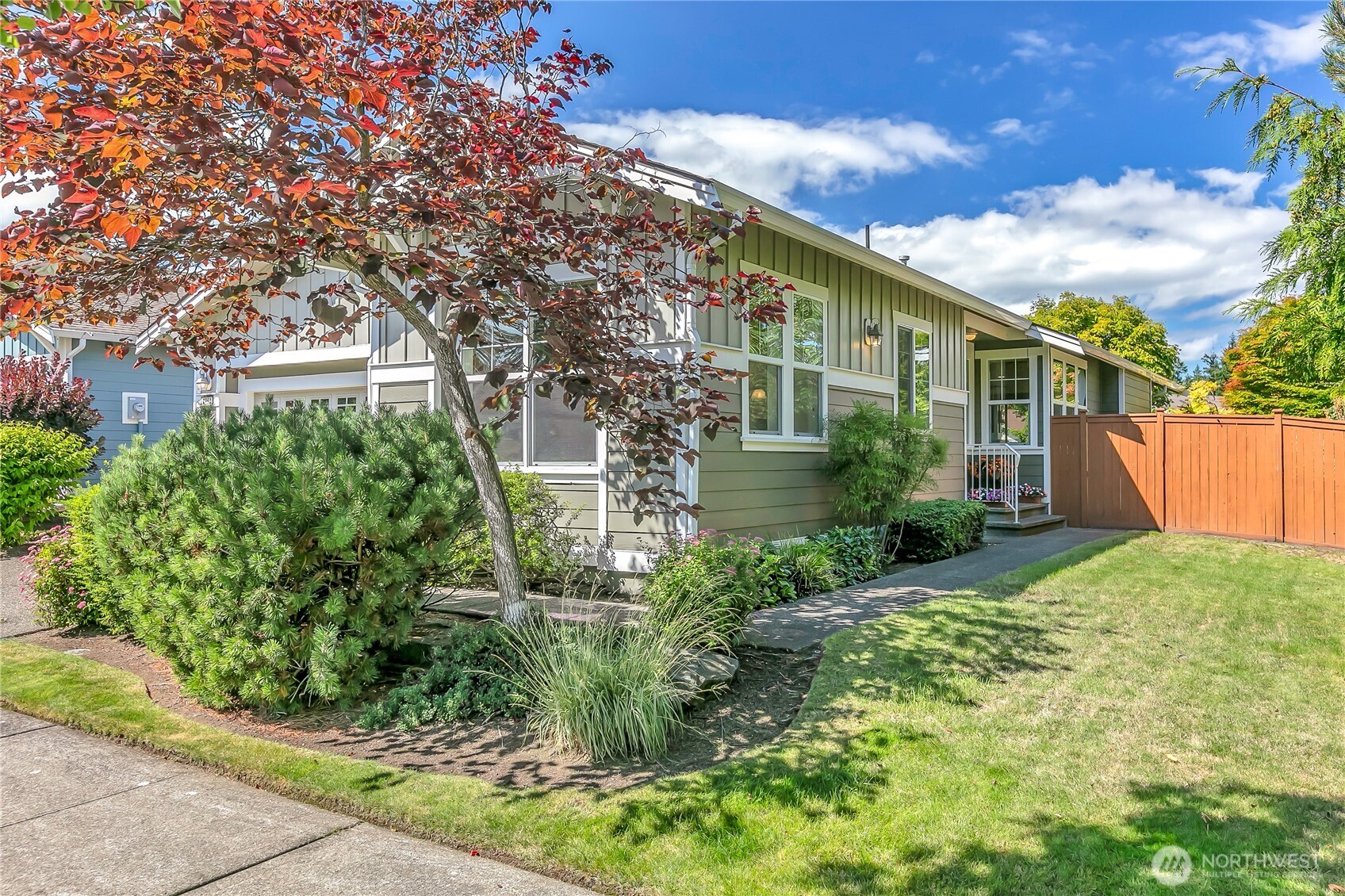 4961 Spokane Street Northeast Lacey, WA 98516 - Photo 3 of 38 a front view of a house with garden