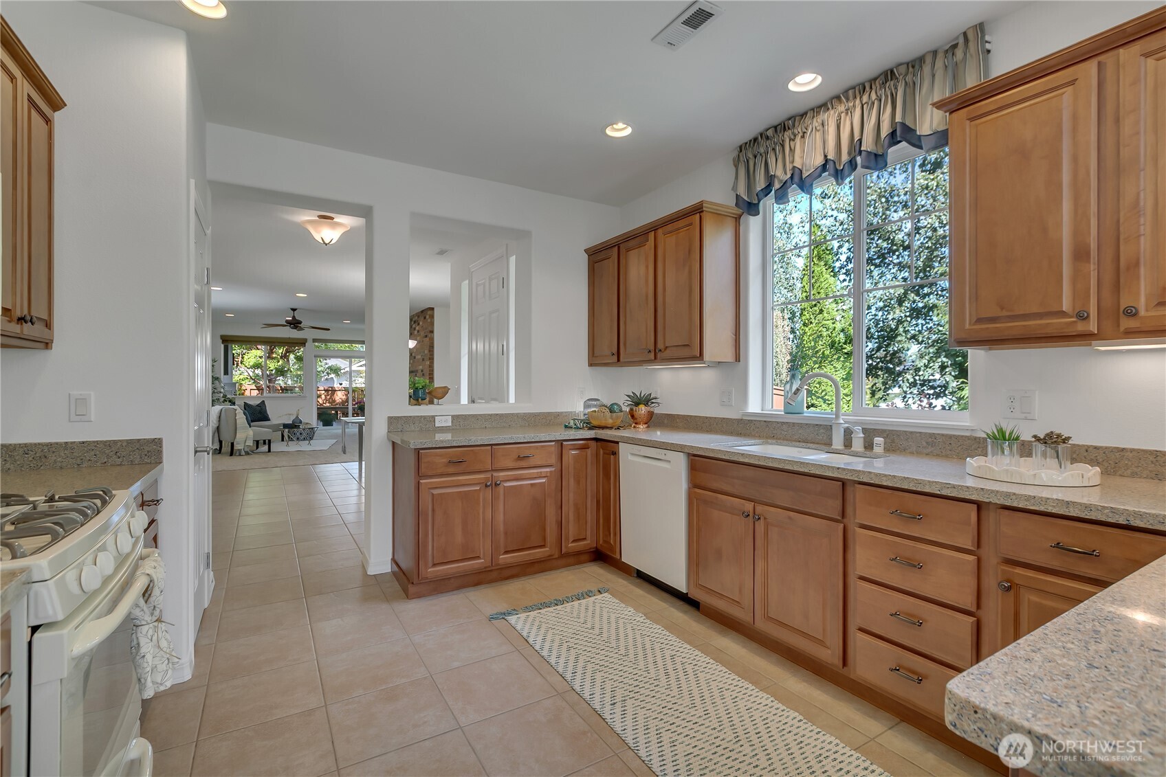 4961 Spokane Street Northeast Lacey, WA 98516 - Photo 9 of 38 a large kitchen with a large window in it