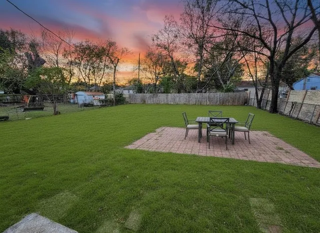 a view of a patio with a garden