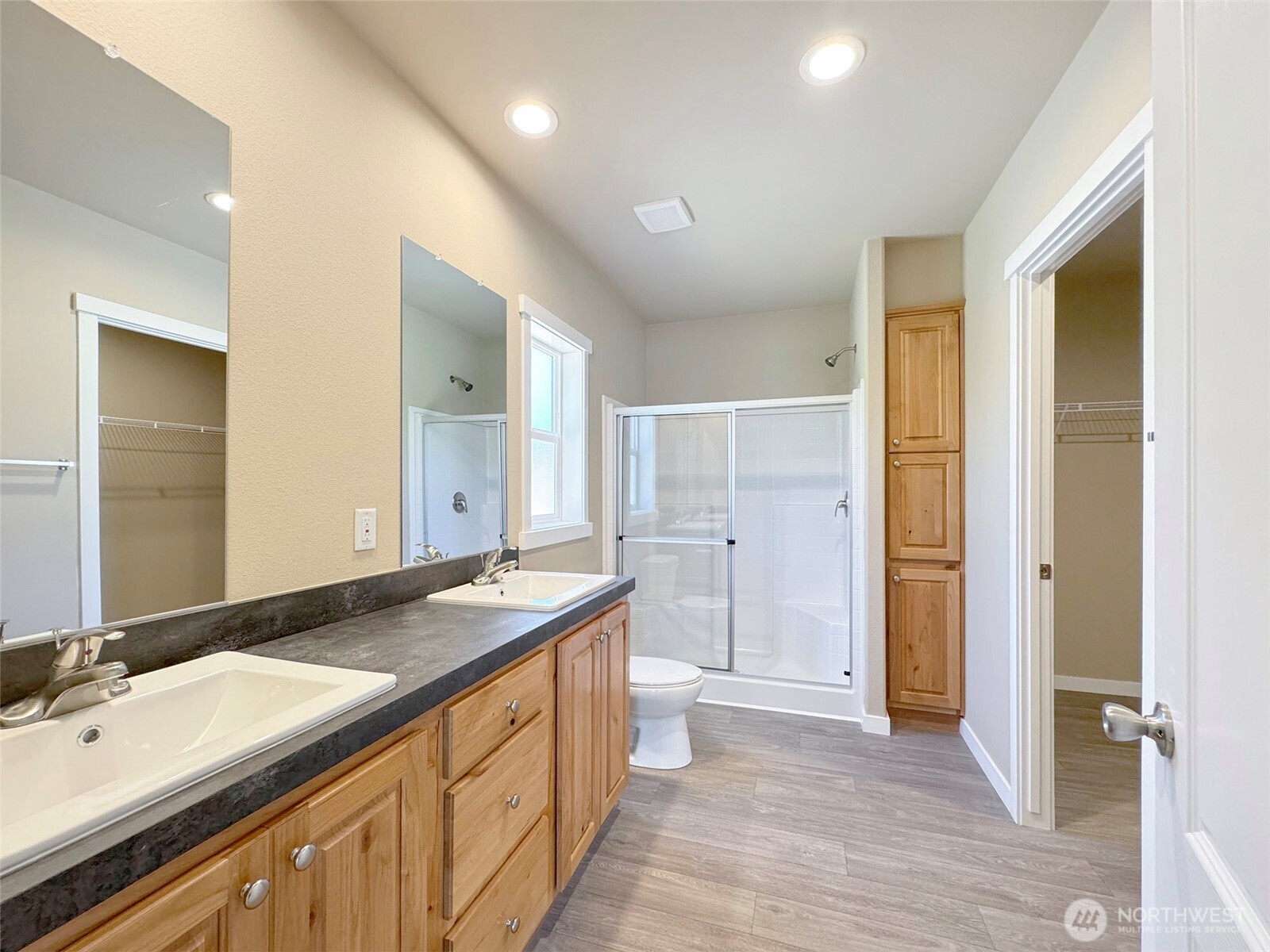 41 Butterfly Lane Pacific Beach, WA 98571 - Photo 21 of 37 a spacious bathroom with a granite countertop sink and a mirror