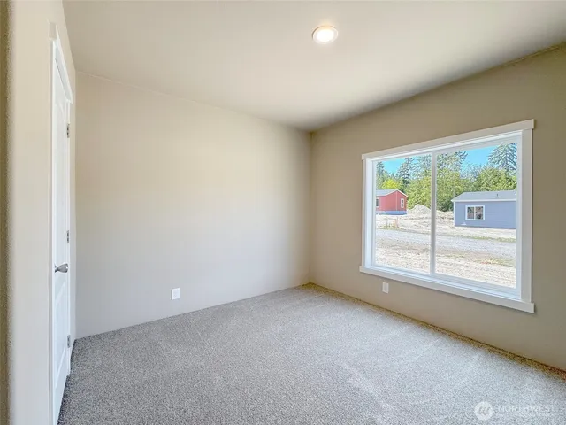 an empty room with closet area