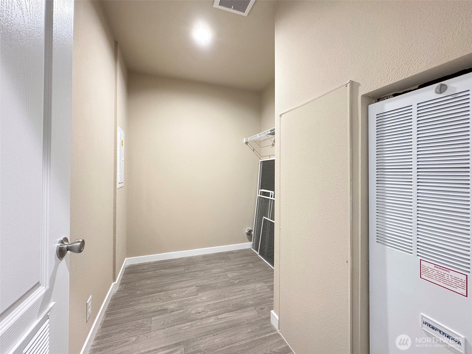 41 Butterfly Lane Pacific Beach, WA 98571 - Photo 32 of 37 a view of a hallway with wooden floor and staircase