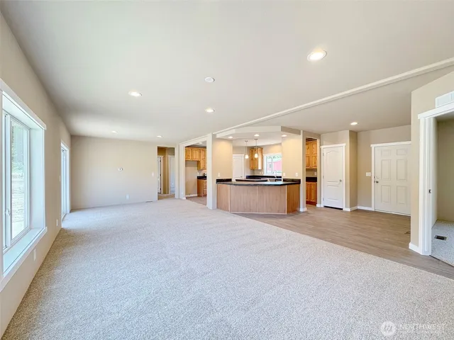 a view of kitchen with refrigerator and window