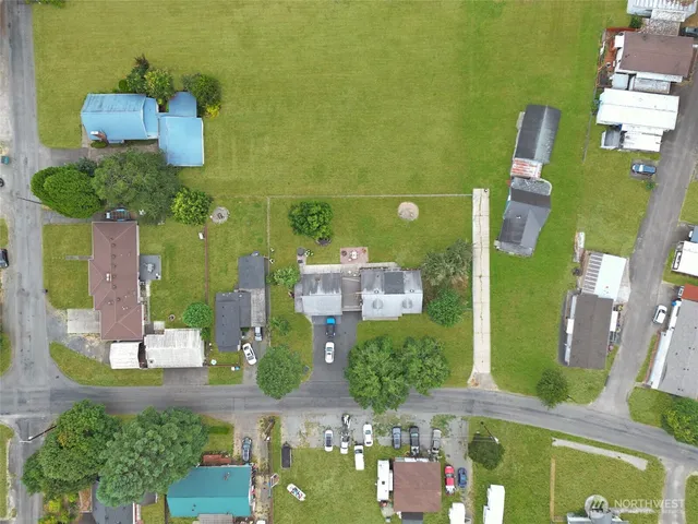 an aerial view of a house with outdoor space