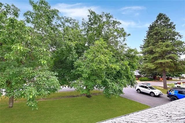 a view of car parked on the side of the road