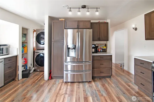 a kitchen with stainless steel appliances a stove and a refrigerator