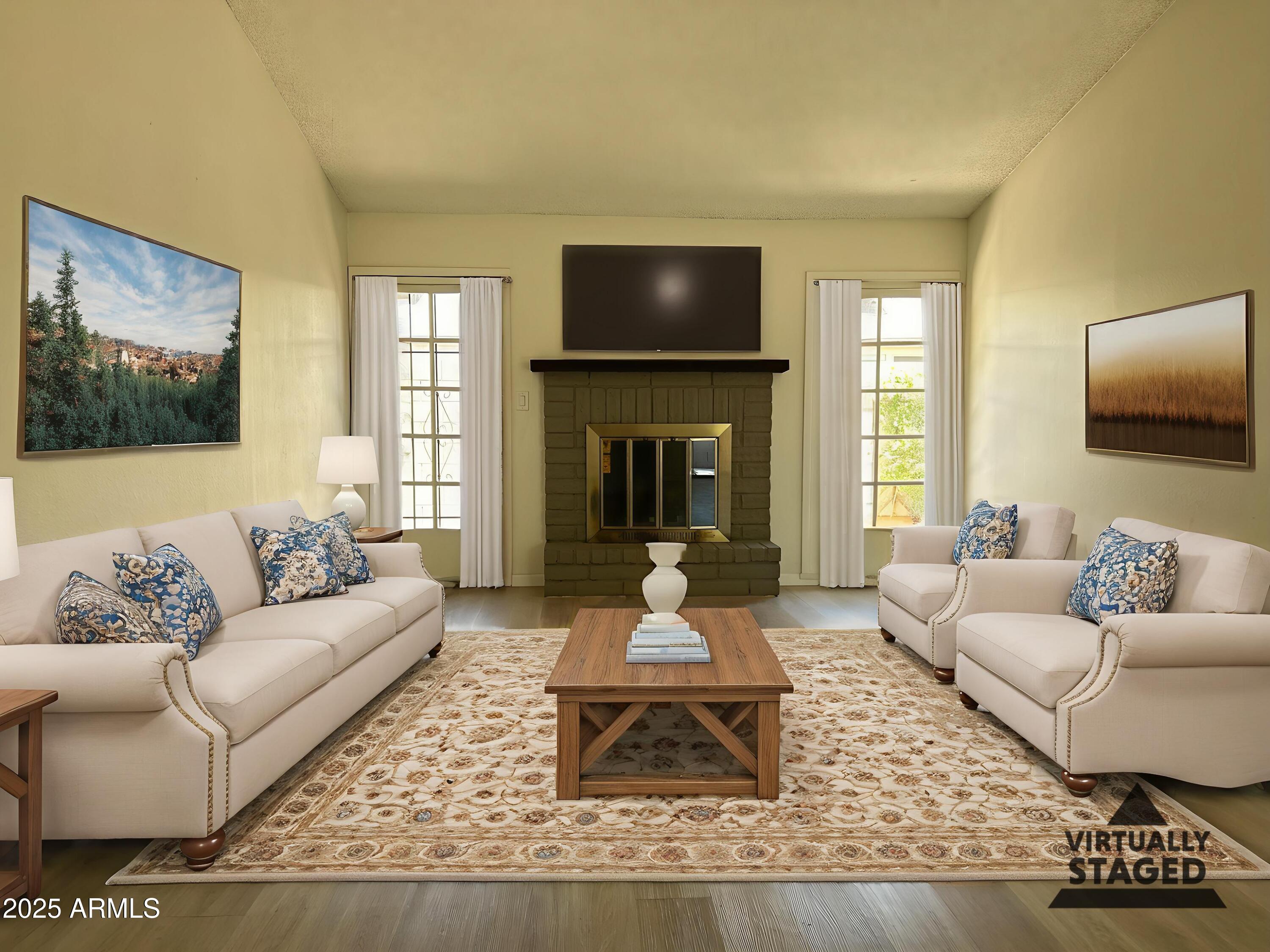 17838 North 45th Avenue Glendale, AZ 85308 - Photo 1 of 17 a living room with furniture couches and a fireplace