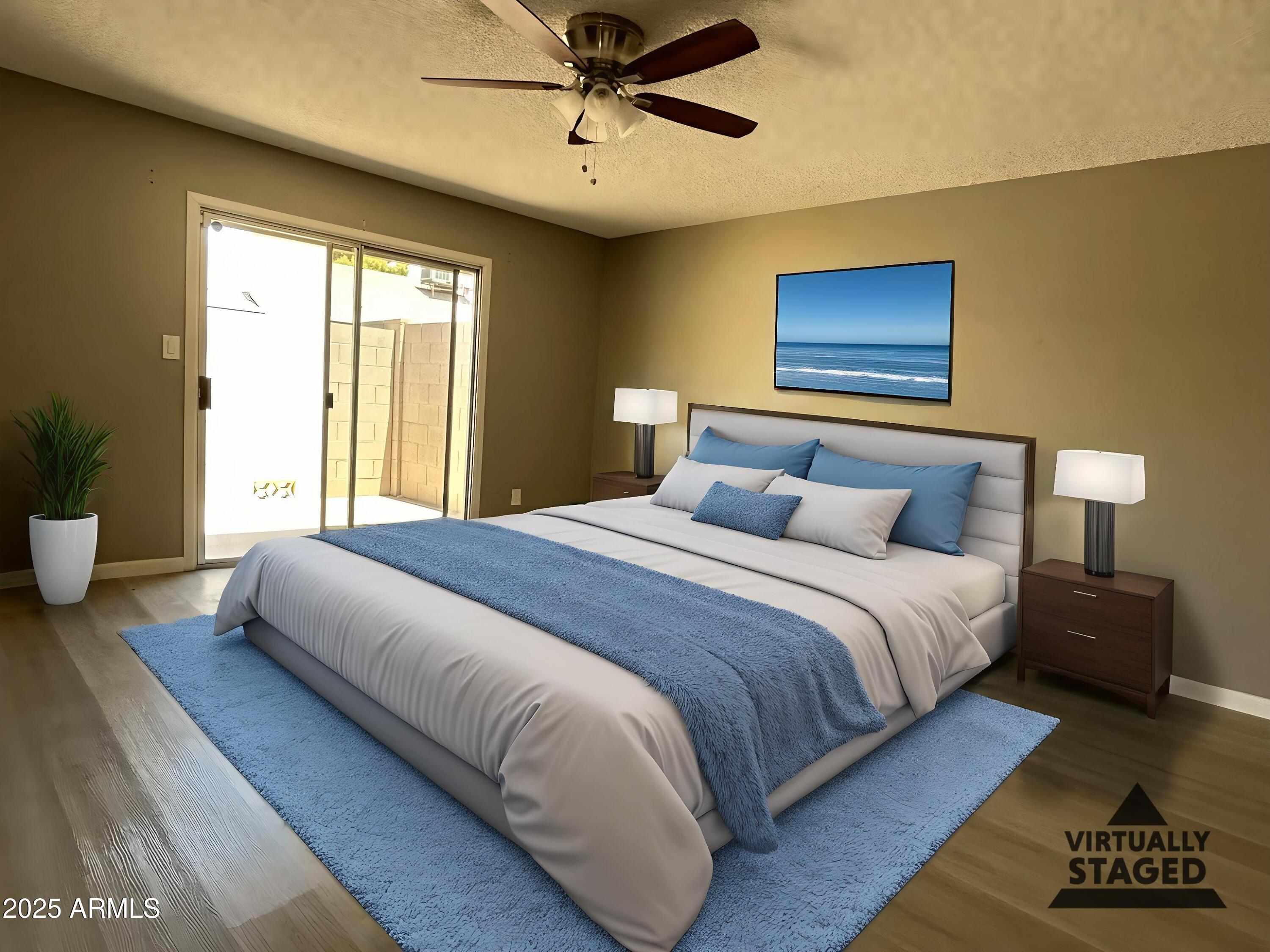 17838 North 45th Avenue Glendale, AZ 85308 - Photo 2 of 17 a bedroom with a bed and wooden floor