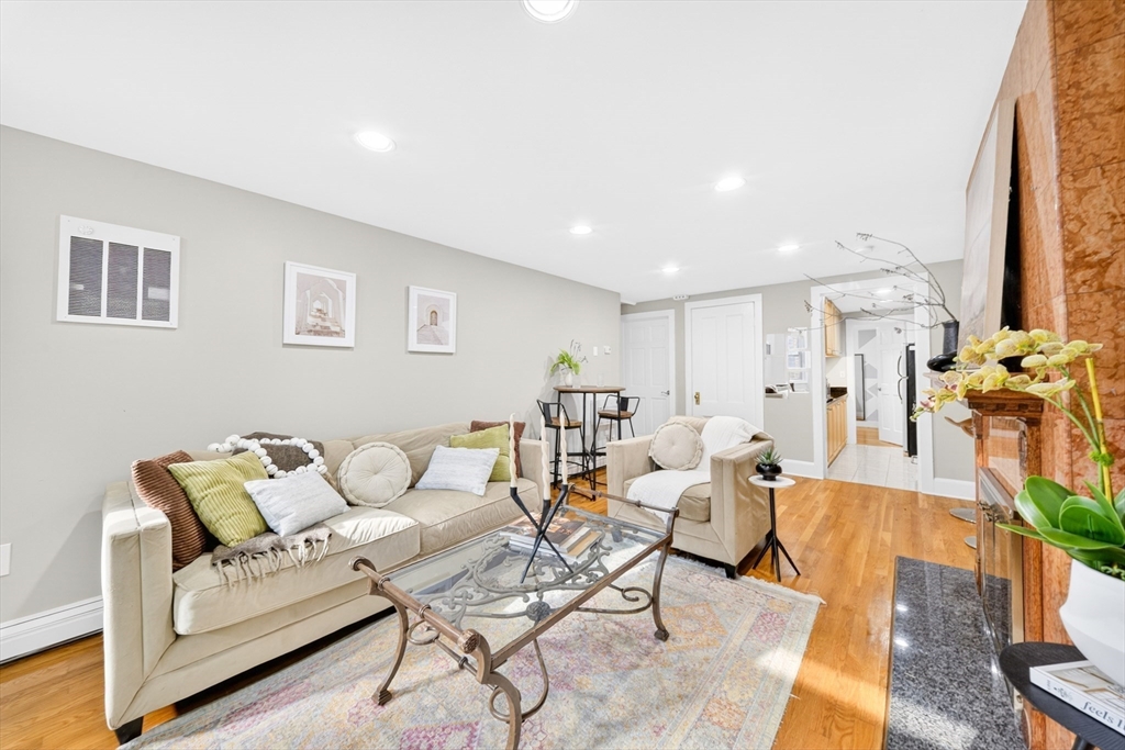 352 Tappan Street, Unit 1 Brookline, MA 02445 - Photo 6 of 42 a living room with furniture and a couch