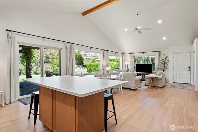 a room with a table chairs and flat screen tv
