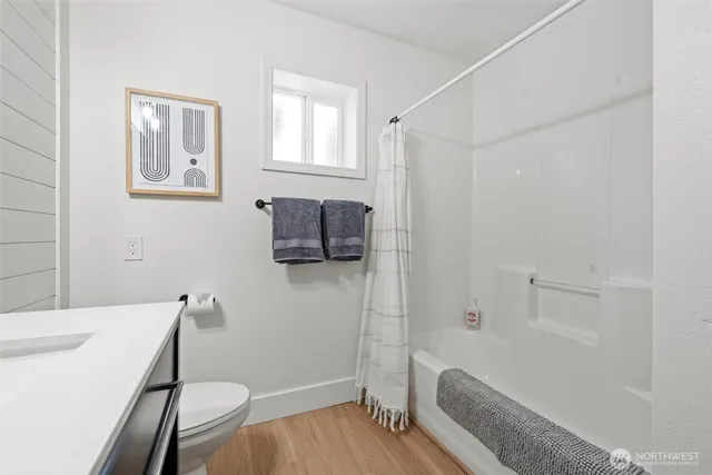 a bathroom with a bathtub a sink and a shower