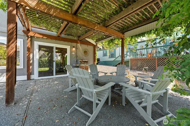 a patio with table and chairs