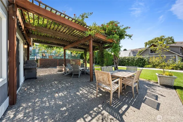 a view of a patio with a table chairs and a patio