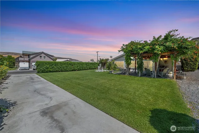 a view of a street with a building in the background