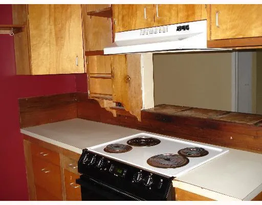 a kitchen with a sink and a stove