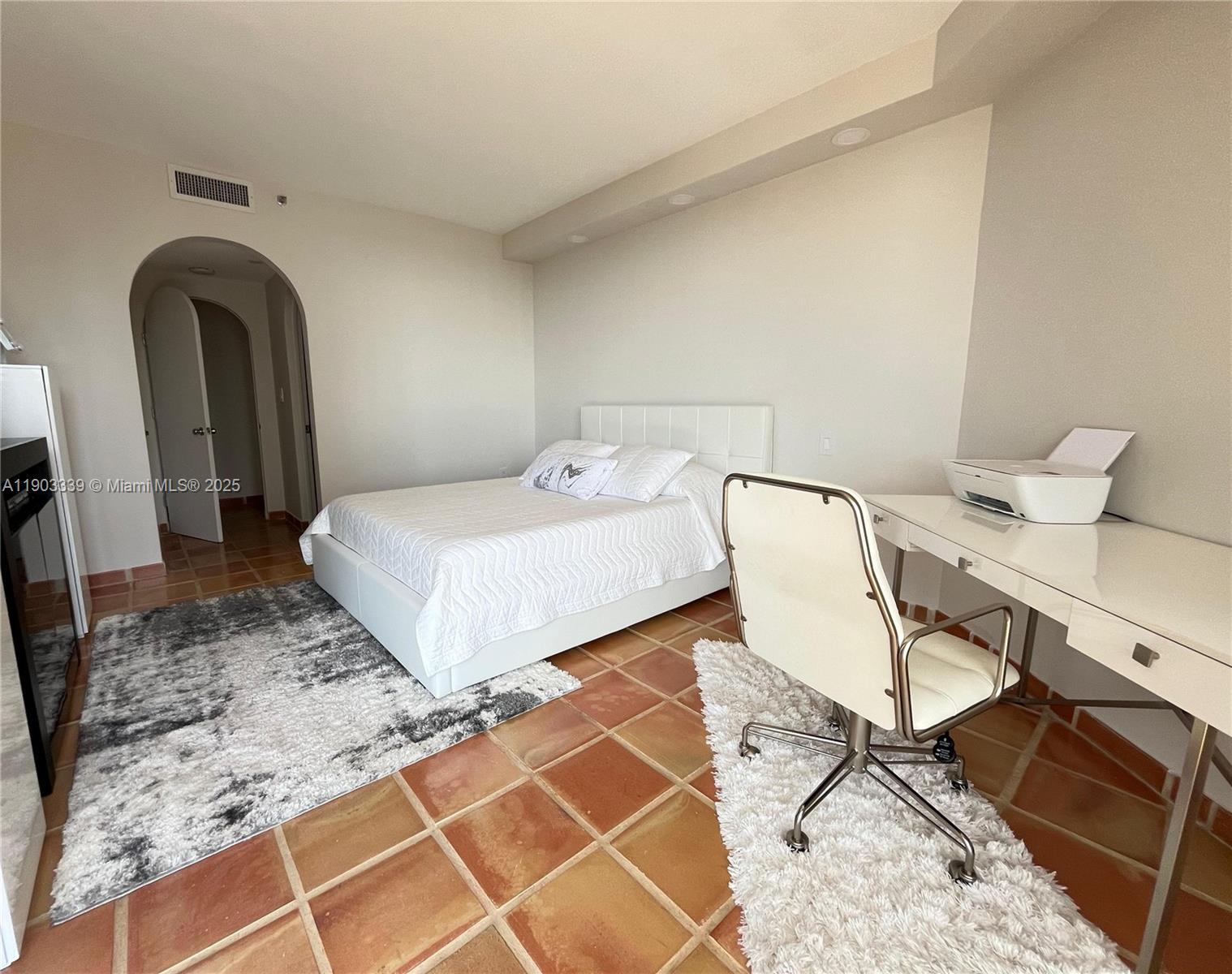 4000 Island Boulevard, Unit 1703 Aventura, FL 33160 - Photo 17 of 29 a bedroom with a bed and cabinets