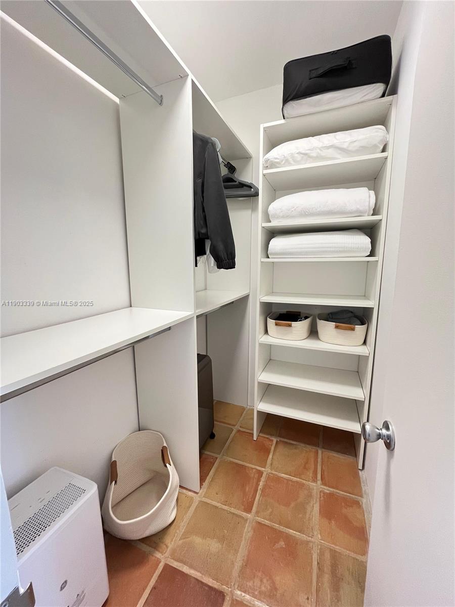 4000 Island Boulevard, Unit 1703 Aventura, FL 33160 - Photo 19 of 29 a bathroom with a sink and a toilet