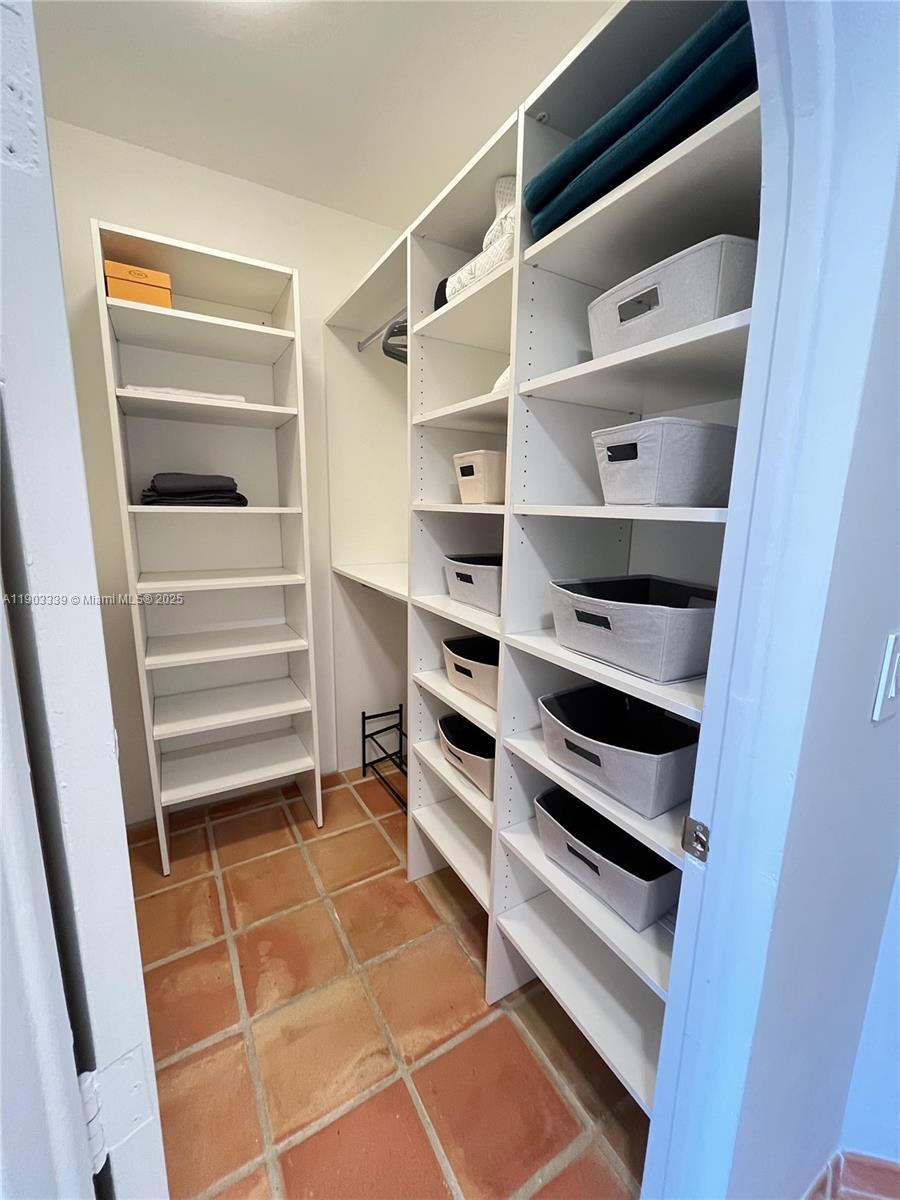 4000 Island Boulevard, Unit 1703 Aventura, FL 33160 - Photo 23 of 29 a view of walk in closet with empty racks