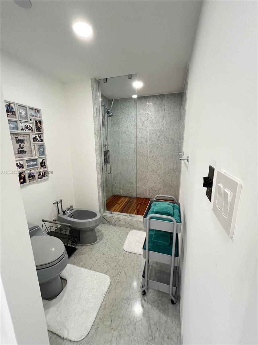 4000 Island Boulevard, Unit 1703 Aventura, FL 33160 - Photo 29 of 29 a living room with furniture and a rug