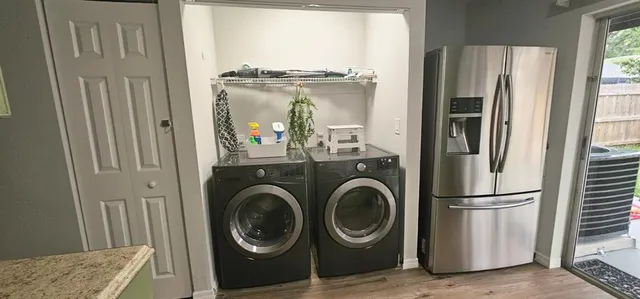 a view of hallway with washer and dryer