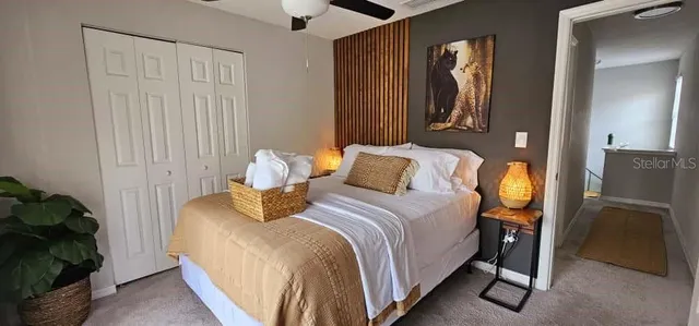 a bed room with a bed and a window