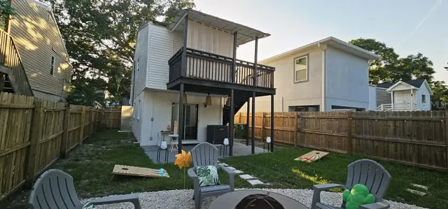 a view of a chair and table in backyard
