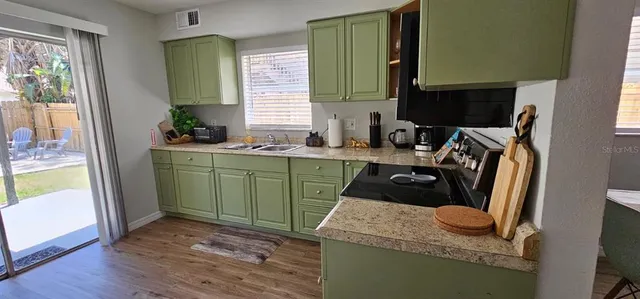 a view of kitchen and bathroom with a sink