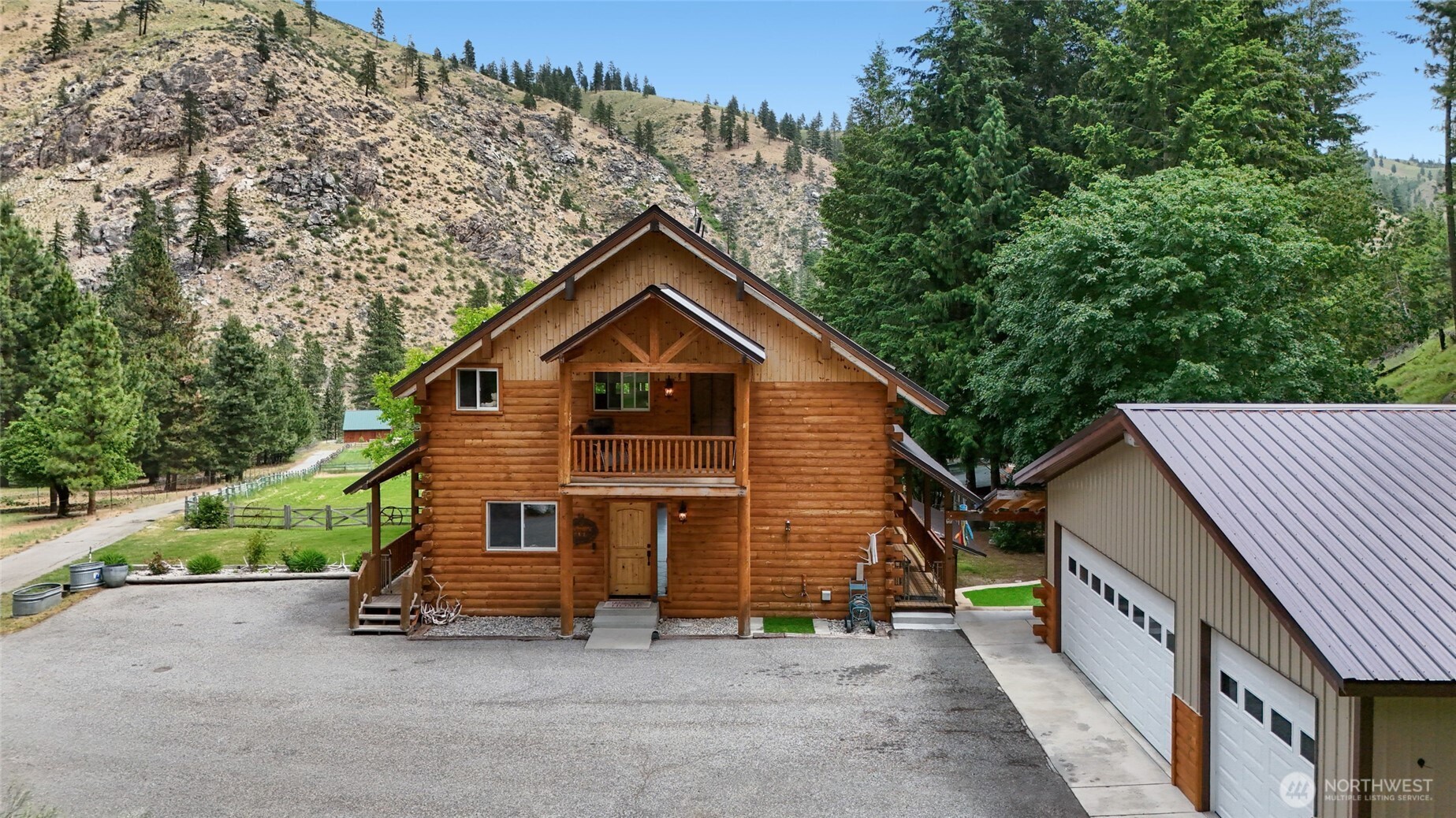 11125 Entiat River Road Entiat, WA 98822 - Photo 5 of 40 a view of a house with a yard and large trees