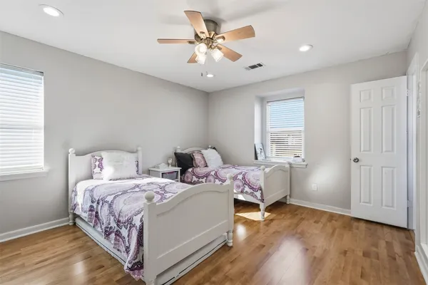 a bedroom with bed and a window