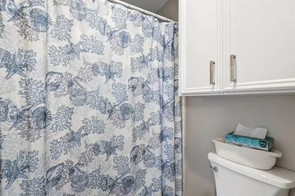 a bathroom with a toilet and a sink