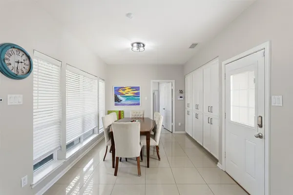 a view of a dining room with furniture and a window