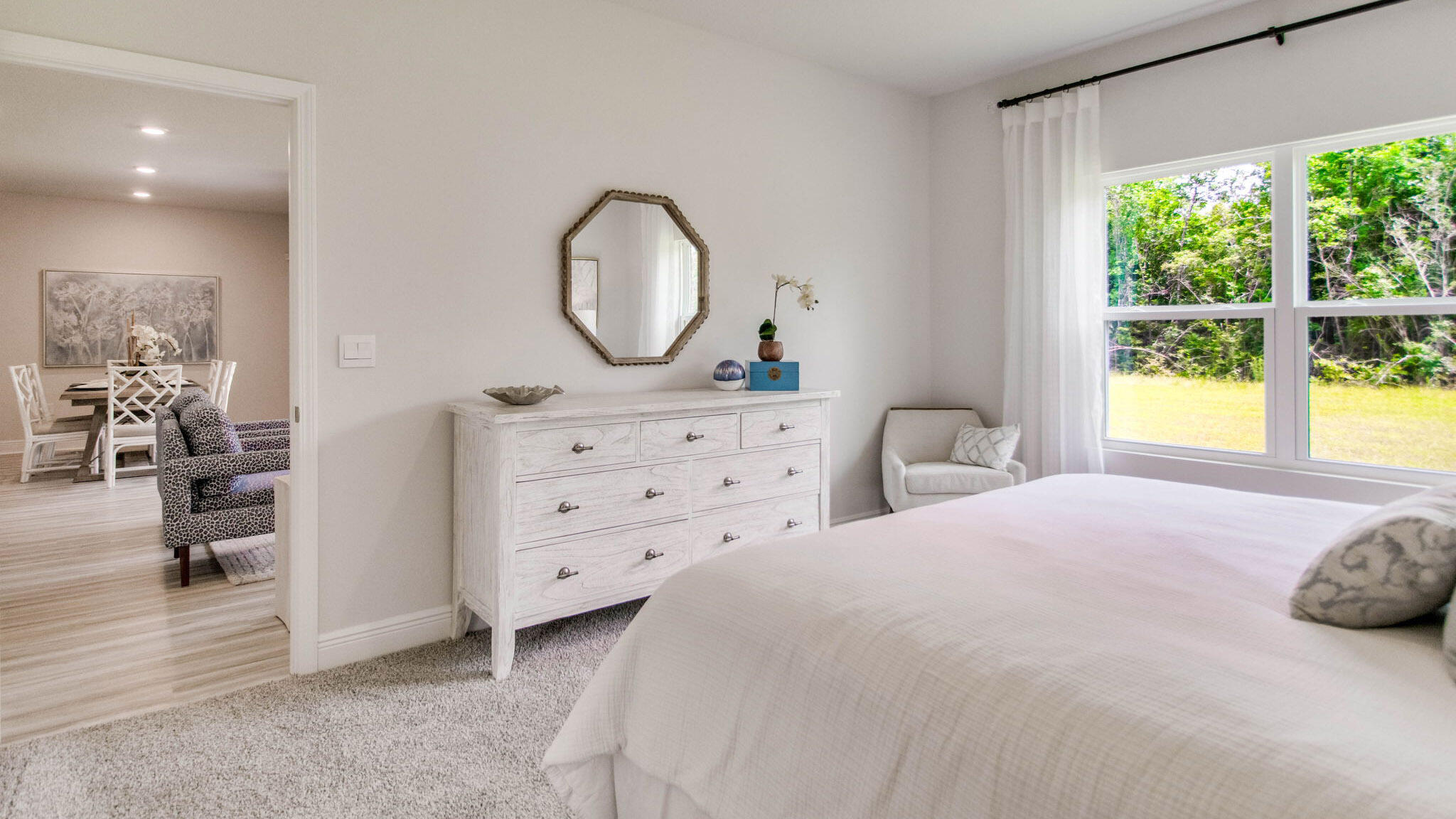 5618 Thatcher Road Crestview, FL 32539 - Photo 11 of 30 a bedroom with a bed and a mirror