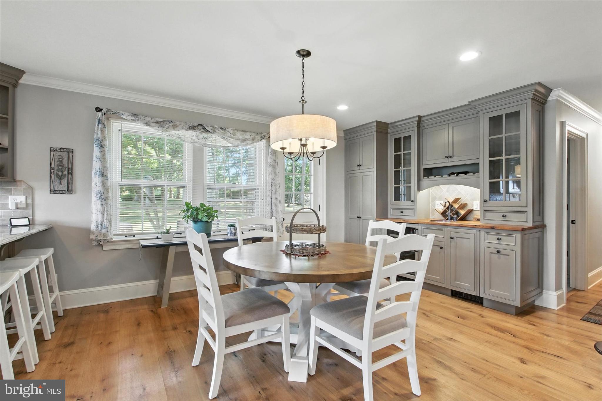 830 Westminster Avenue Hanover, PA 17331 - Photo 21 of 43 a dining room with furniture window wooden floor and a chandelier