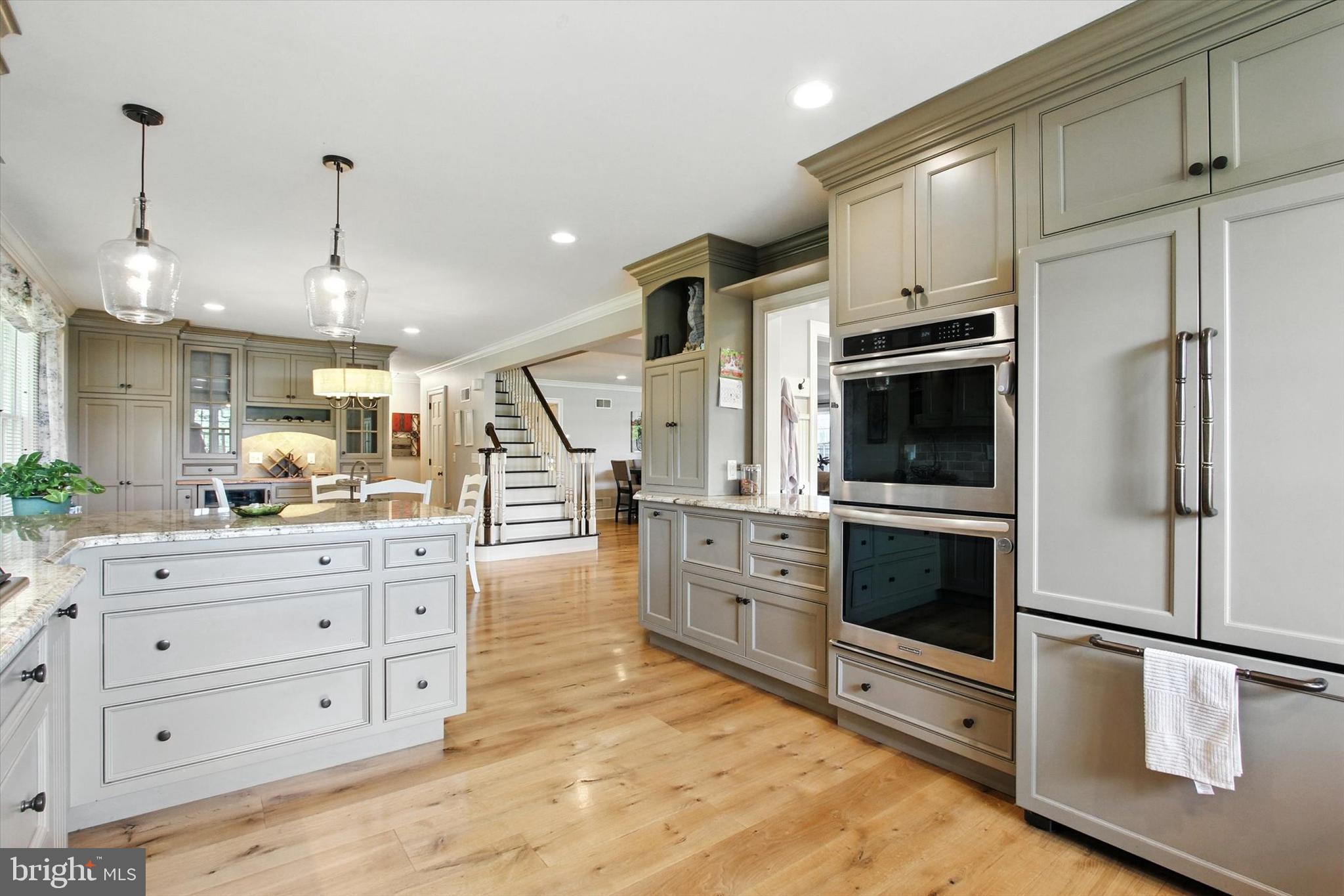 830 Westminster Avenue Hanover, PA 17331 - Photo 24 of 43 a kitchen with stainless steel appliances white cabinets and wooden floors