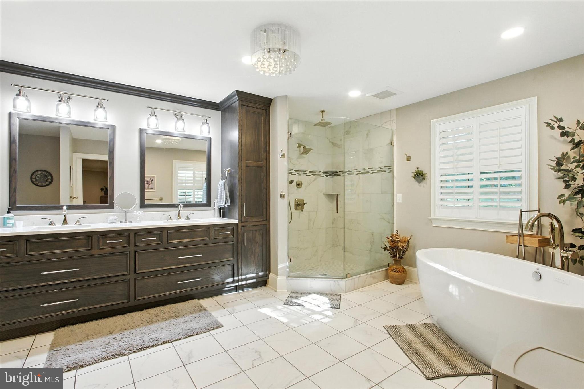 830 Westminster Avenue Hanover, PA 17331 - Photo 33 of 43 a spacious bathroom with a bathtub sink and a mirror
