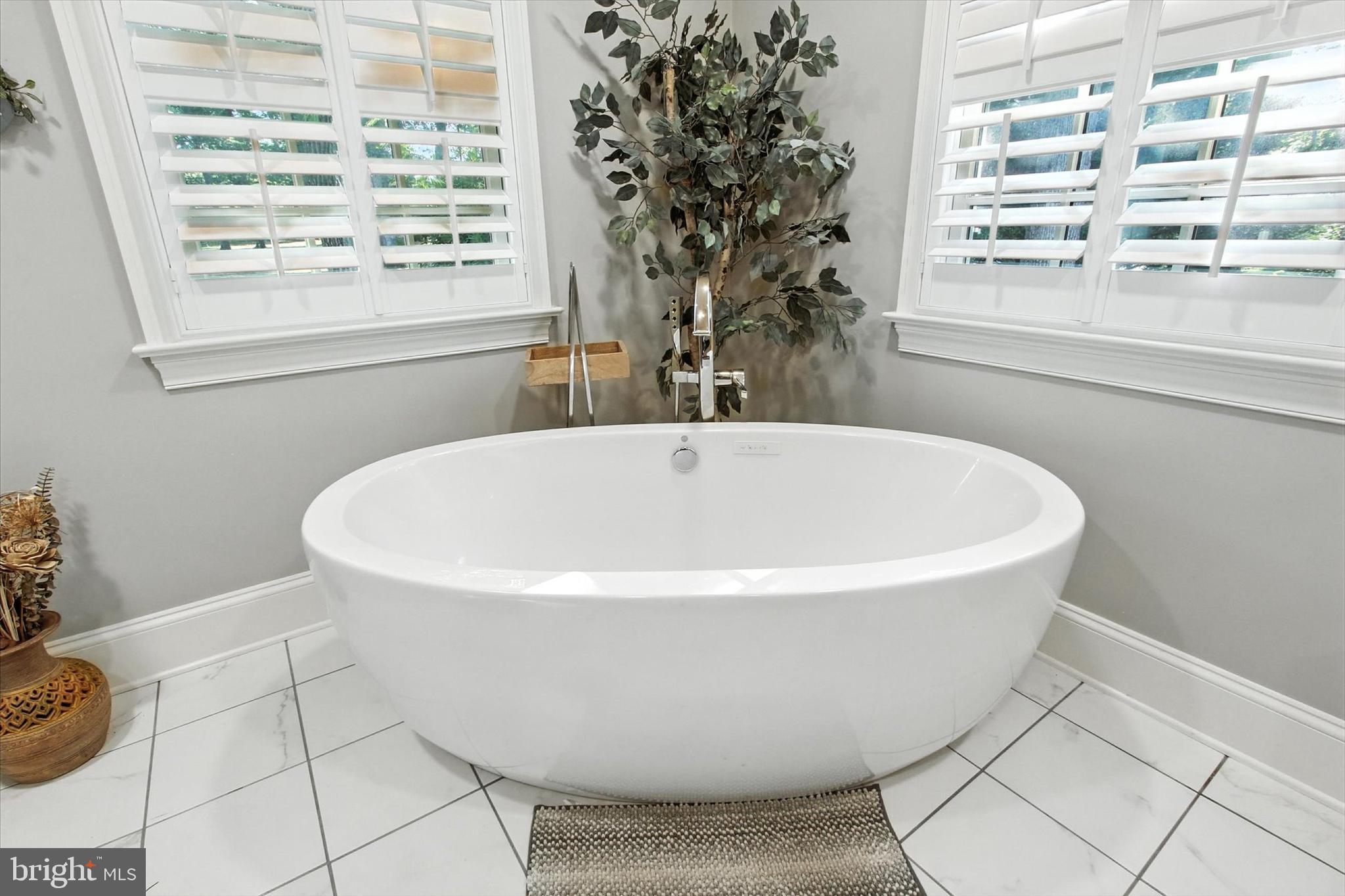 830 Westminster Avenue Hanover, PA 17331 - Photo 34 of 43 a white bath tub sitting in a bathroom next to a window