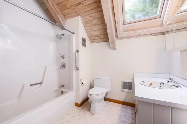 a bathroom with a sink a toilet and a bathtub