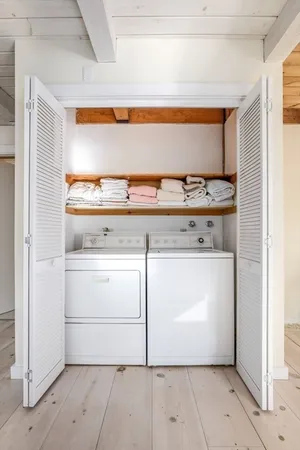 a utility room with washer and dryer