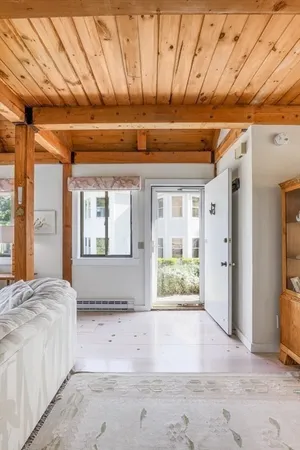 a spacious bedroom with a large bed and a window