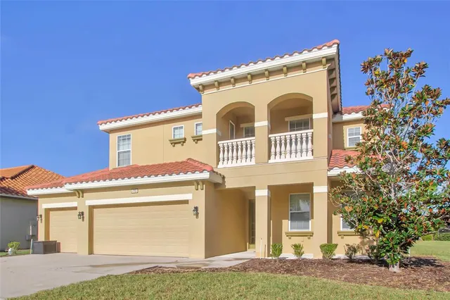 a kitchen with stainless steel appliances kitchen island granite countertop a refrigerator a stove a sink a dining table and chairs