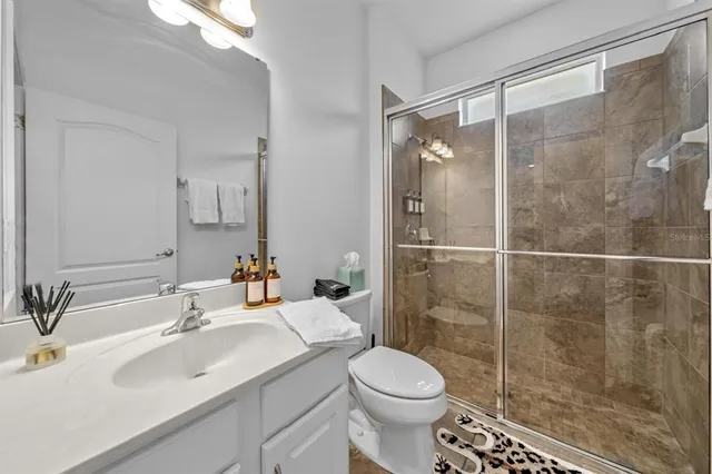 a bathroom with a sink a vanity and a mirror