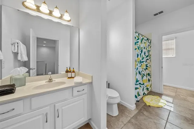 a view of a swimming pool with a table and chairs