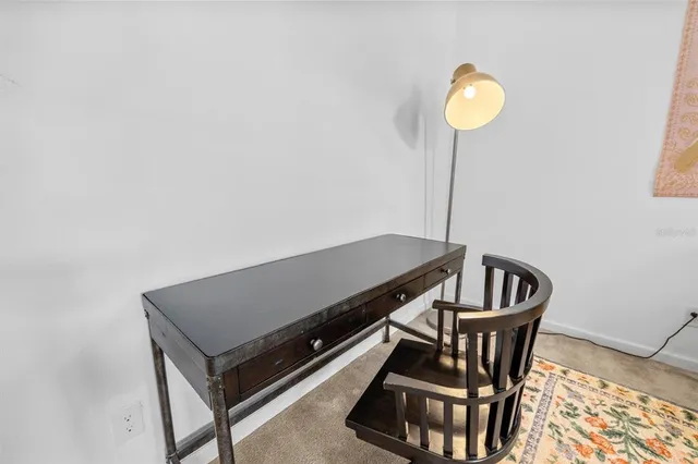 a view of a livingroom with furniture and a ceiling fan