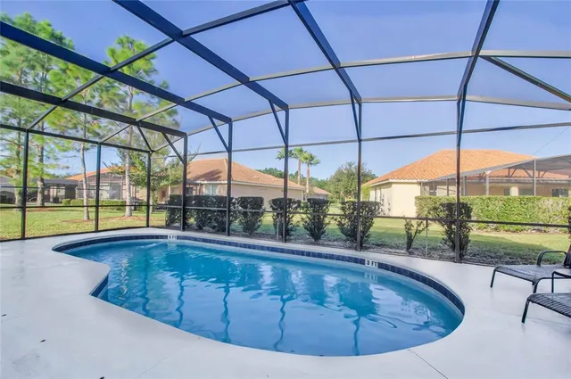 a kitchen with granite countertop a sink a stove and cabinets