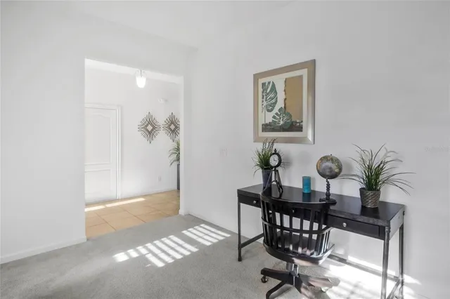 a bedroom with a bed and a television